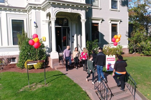 People walk in front of the Swearer Center